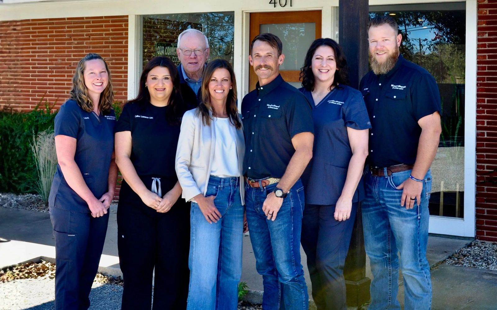 The team at Hill Country Chiropractic and Wellness Center outside their office at 401 Junction Hwy in Kerrville, TX